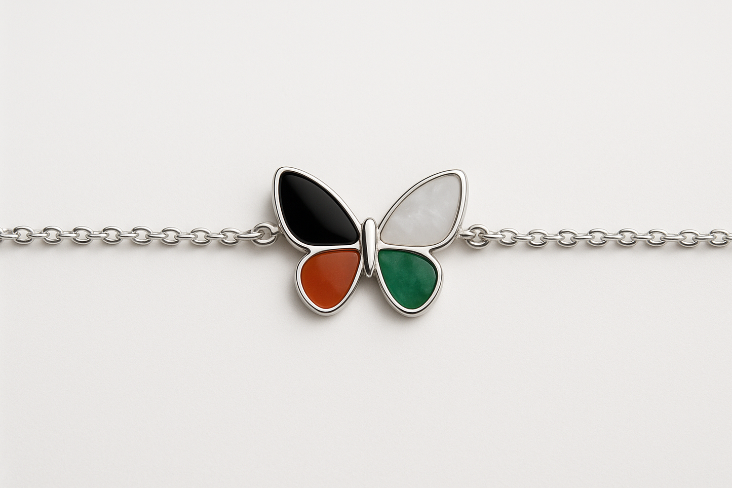Thin silver bracelet with butterfly-shaped mosaic pendant
