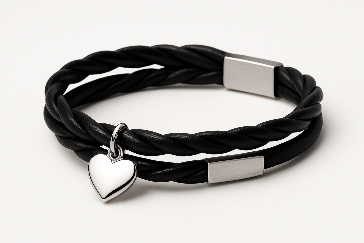 Twisted two layer black Leather bracelet with a silver charm heart pendant and a silver plate on the other side