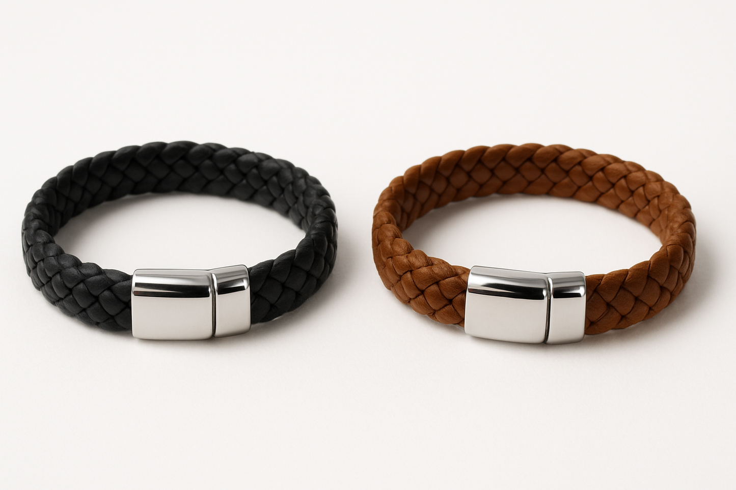 Two single row knitted leather bracelets - black and brown with shiny silver clasps on white background