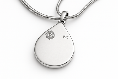 Back of pendant with logo top left and 925 top right for engraving space