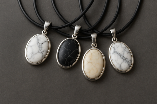 Collection of silver marble pendants on black leather cords