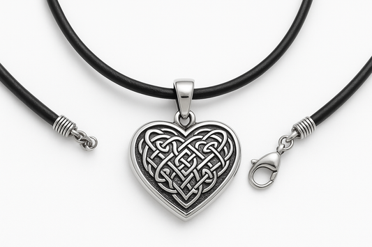 Heart-shaped silver pendant with Celtic knot engraving on black leather cord