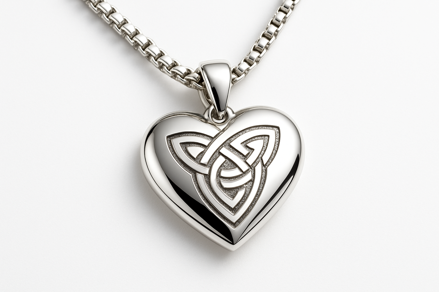 Heart-shaped silver pendant with Celtic knot on silver box chain
