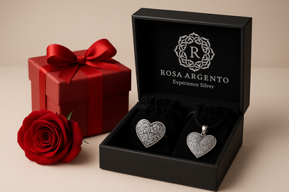 Luxury jewelry presentation with Rosa argento pieces in elegant gift boxes