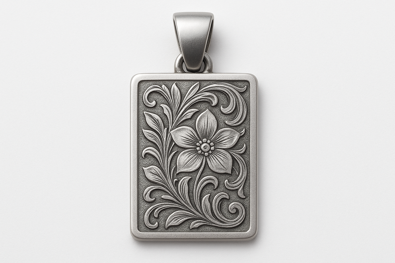 Matte silver rectangular pendant with floral engraving