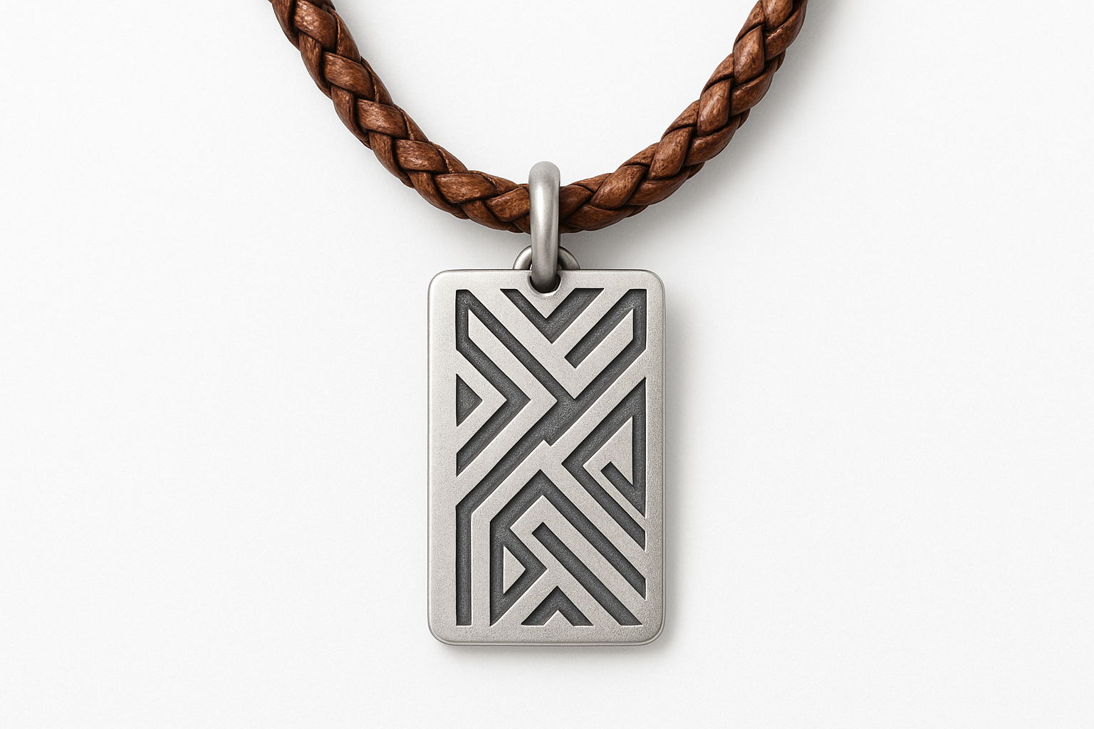 Rectangular silver pendant with geometric patterns on brown braided leather