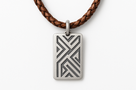 Rectangular silver pendant with geometric patterns on brown braided leather