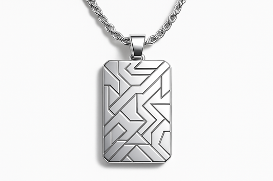 Rectangular silver pendant with geometric patterns on silver rope chain