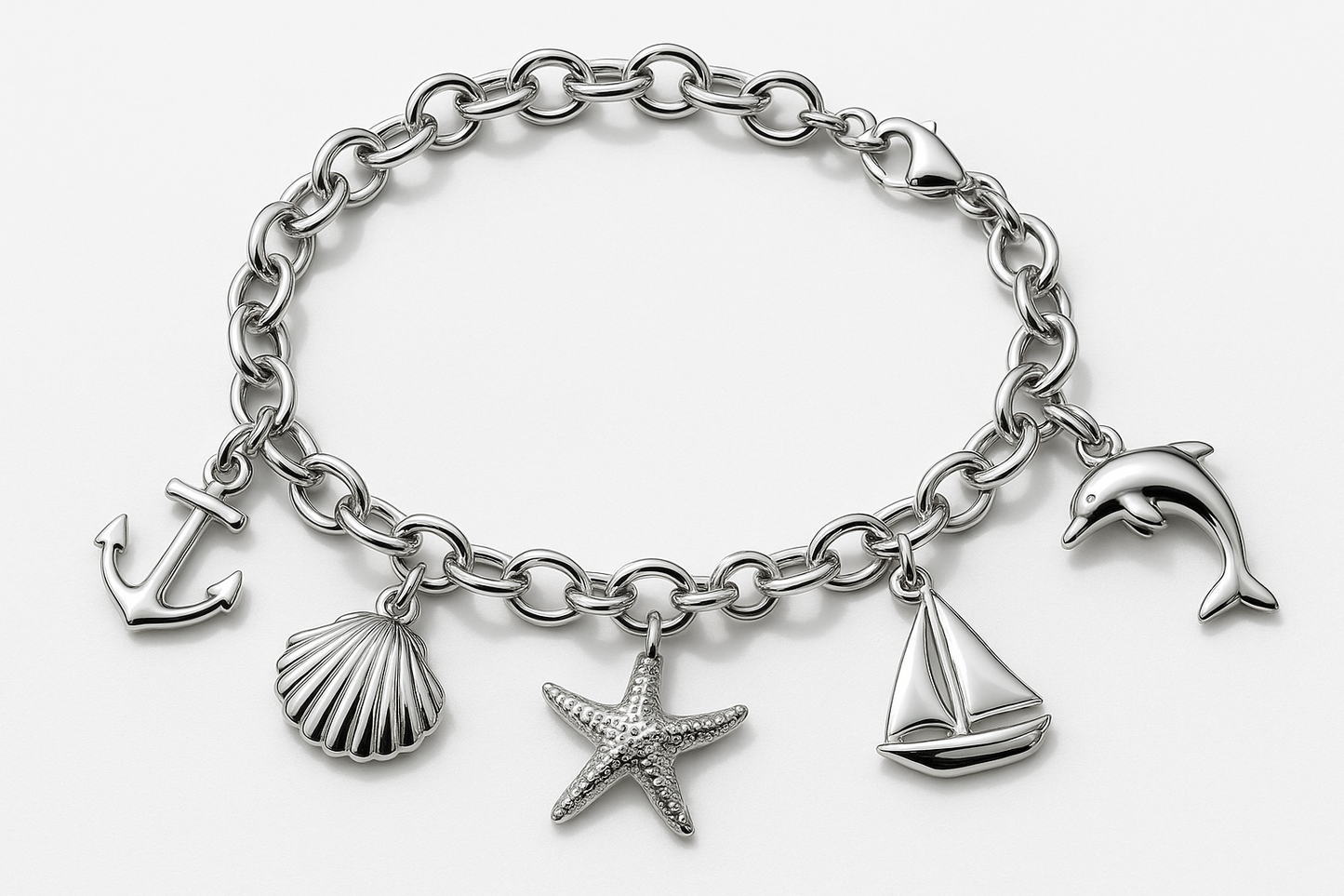 Shining silver charm bracelet with nautical charms including anchor, seashell, starfish, sailboat, and dolphin