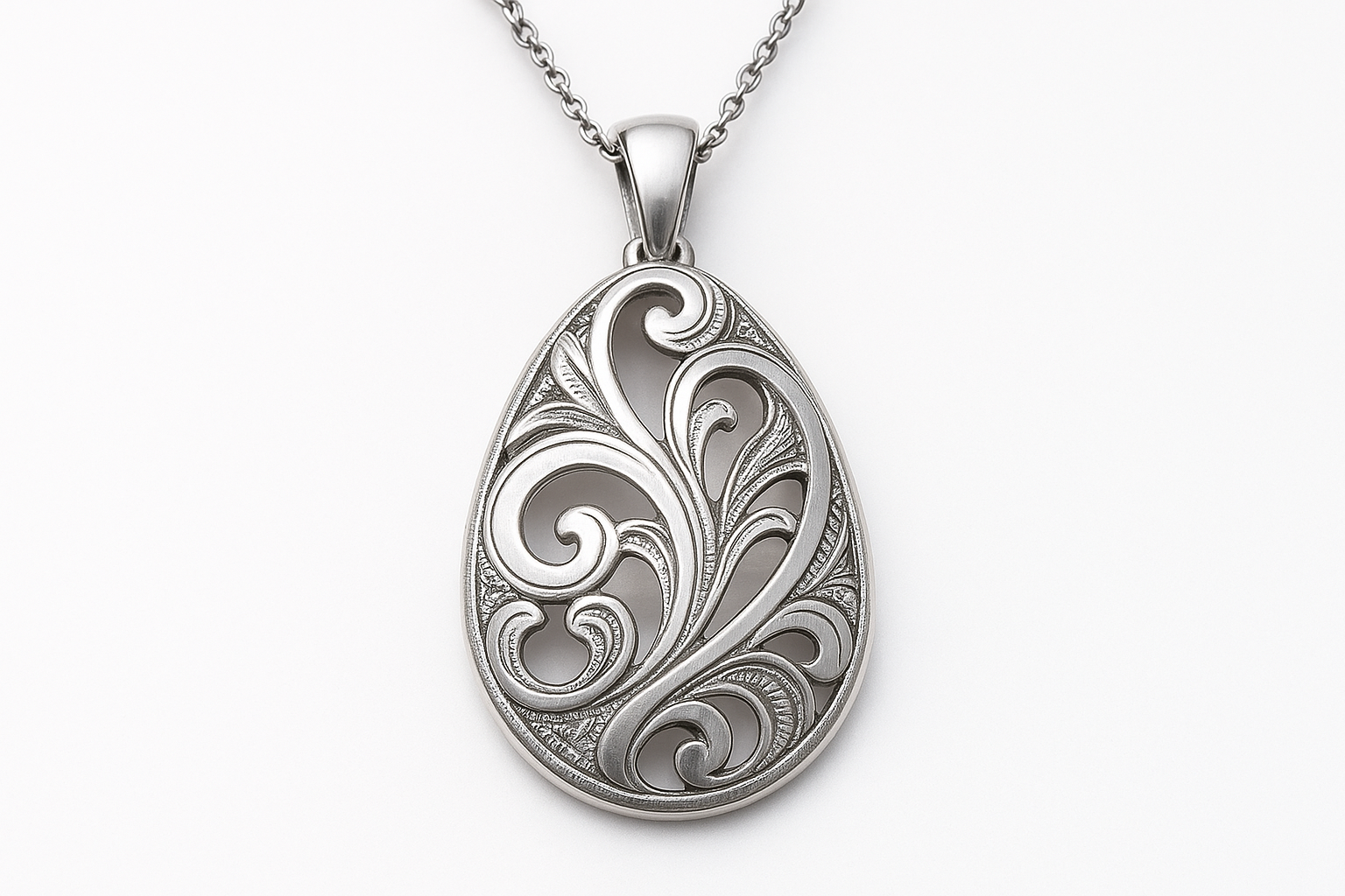 Silver pendant necklace with shiny and matte finishes, engravings, and empty spaces