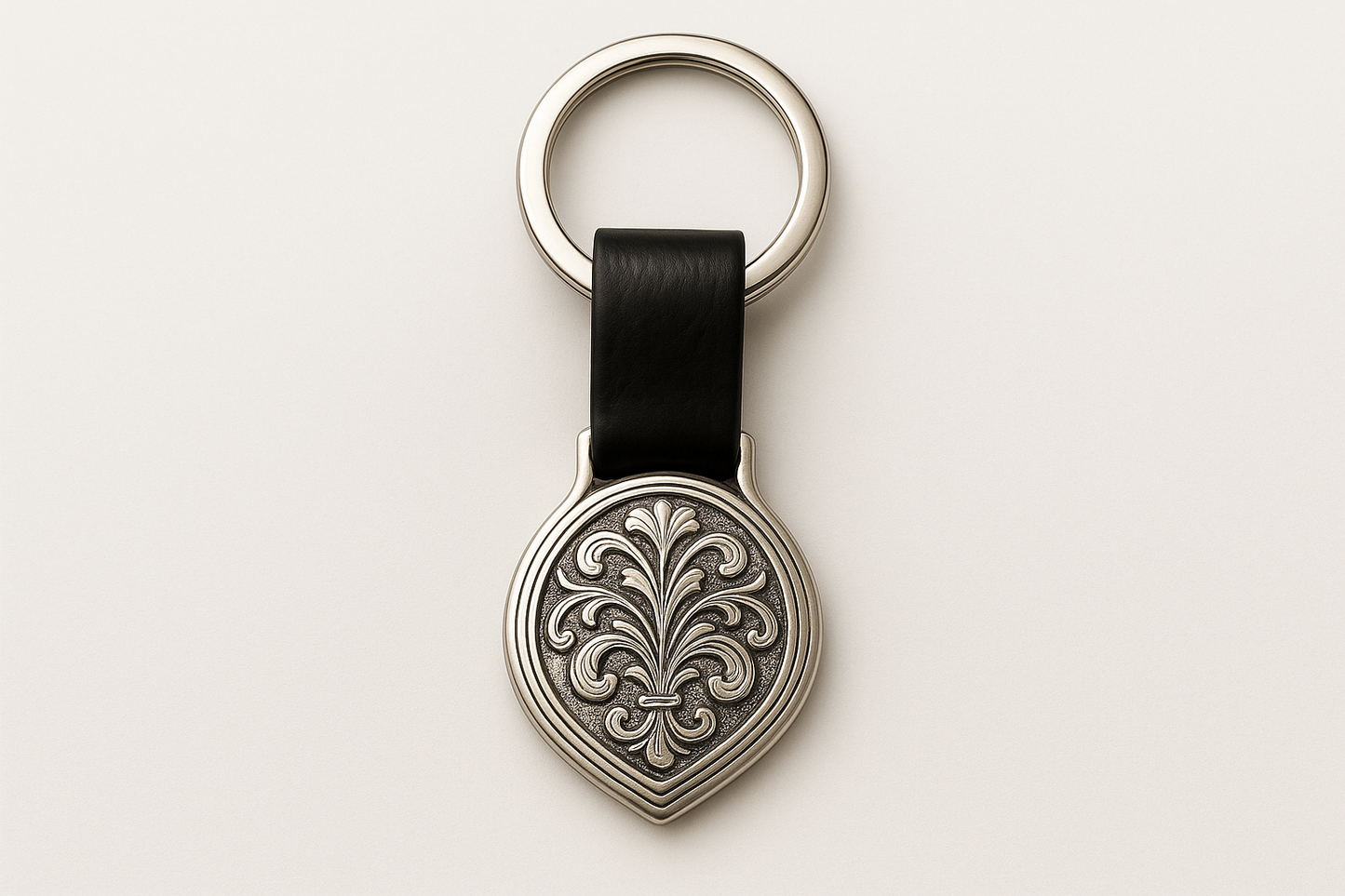 Teardrop-shaped keychain with leaf patterns
