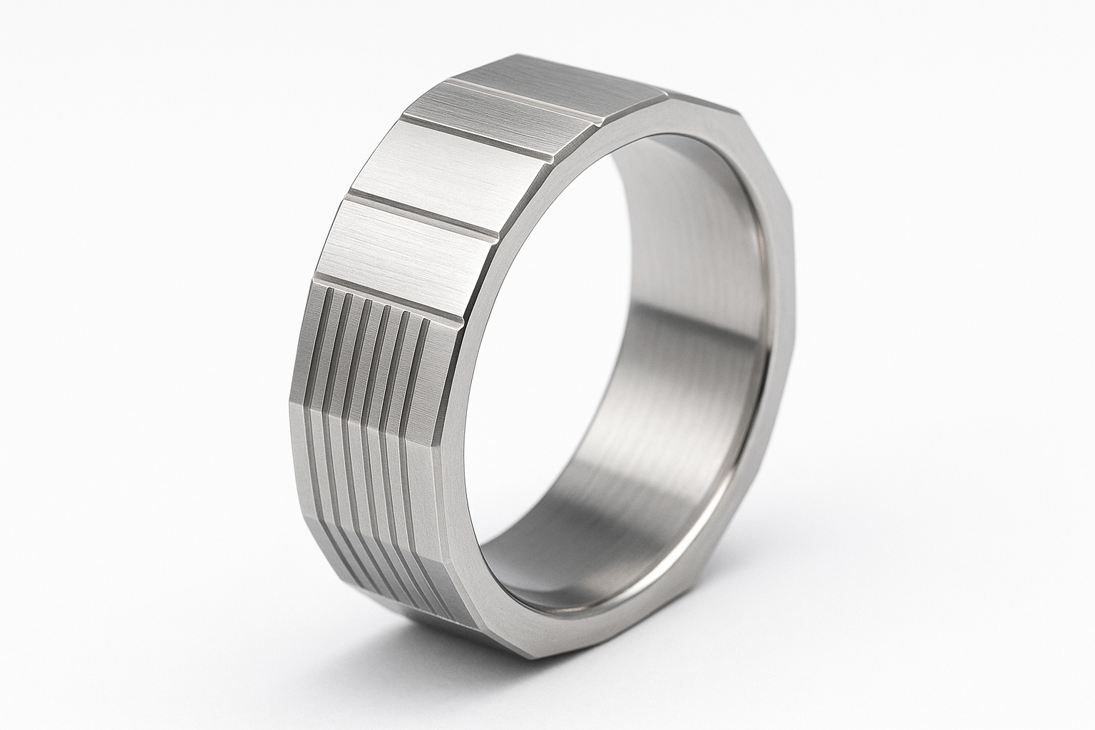 Thin square-edged silver ring with linear engravings